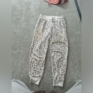 Tan and white cheetah print jogger pants